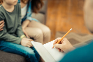 parents writing notes for IEP meeting